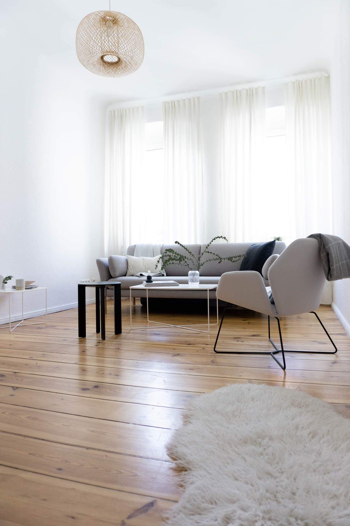 Sheepskin Rug and Grey Sofa, Minimalist Living Room, Scandinavian Home - Berlin Flat Rebecca Goddard - RG Daily Blog