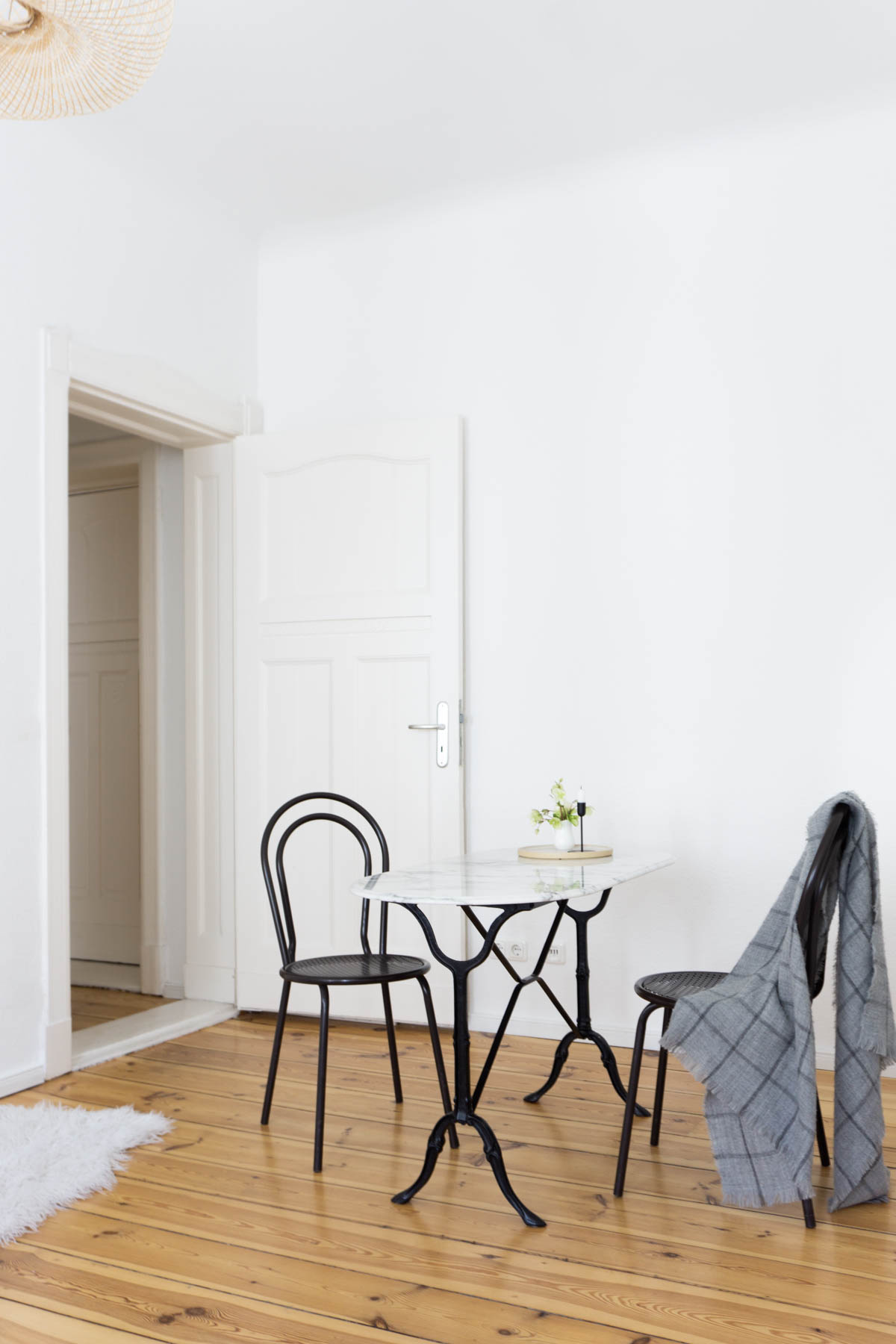 Black Thonet Chairs Marble Table Dinning Area, Minimalist Living Room, Scandinavian Home - Berlin Flat Rebecca Goddard - RG Daily Blog