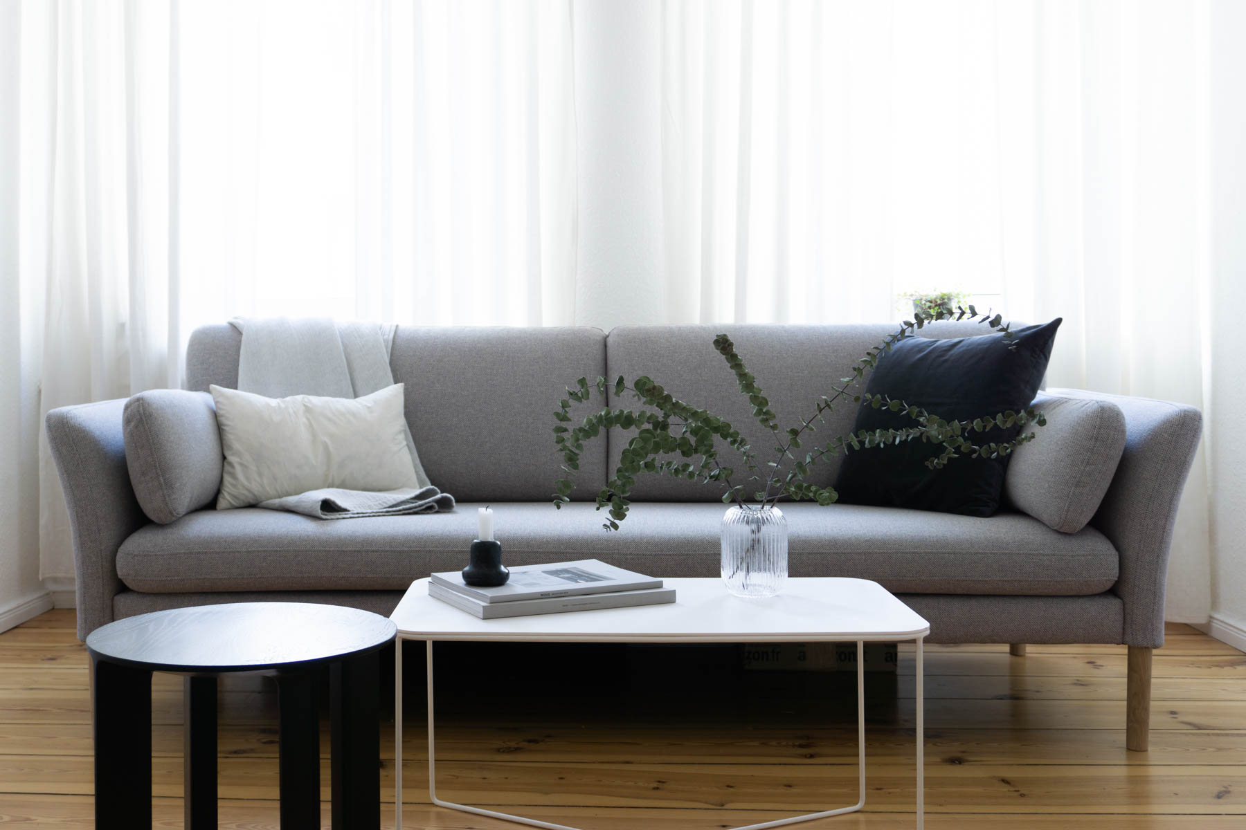 Eucalyptu and Grey Sofa, Minimalist Living Room, Scandinavian Home - Berlin Flat Rebecca Goddard - RG Daily Blog