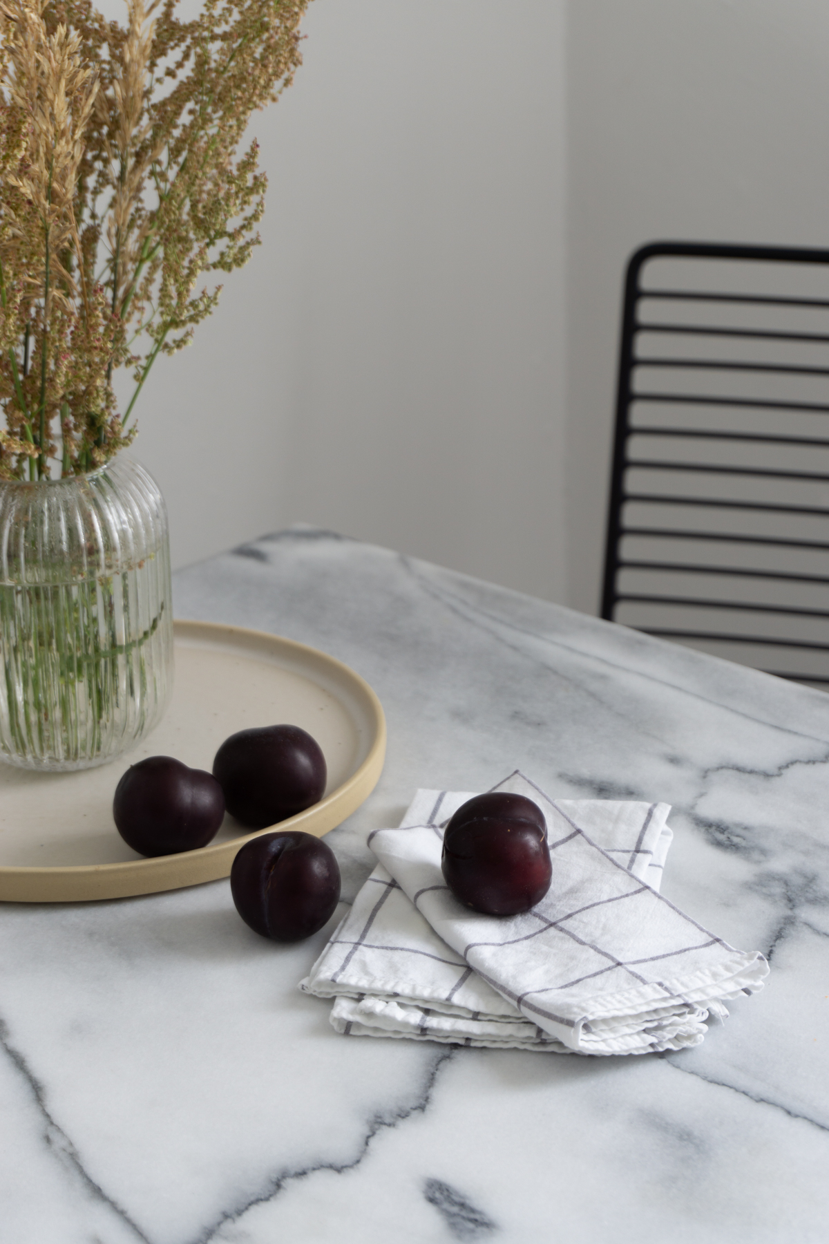 White and Beige Danish Inspired Kitchen | Alva Concept Ceramics, Plums, Marble Kitchen Table, Wheat Arrangement - RG Daily Blog, Interior Design