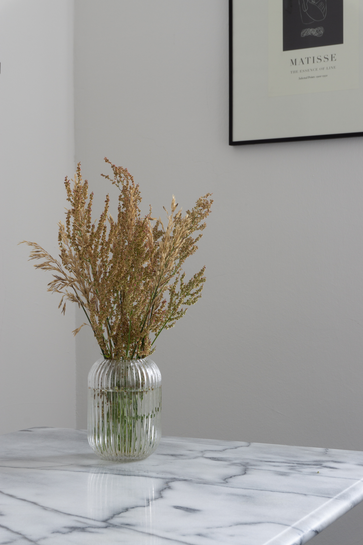 White and Beige Danish Inspired Kitchen | Matisse Artwork, Marble Kitchen Table, Wheat Arrangement - RG Daily Blog, Interior Design