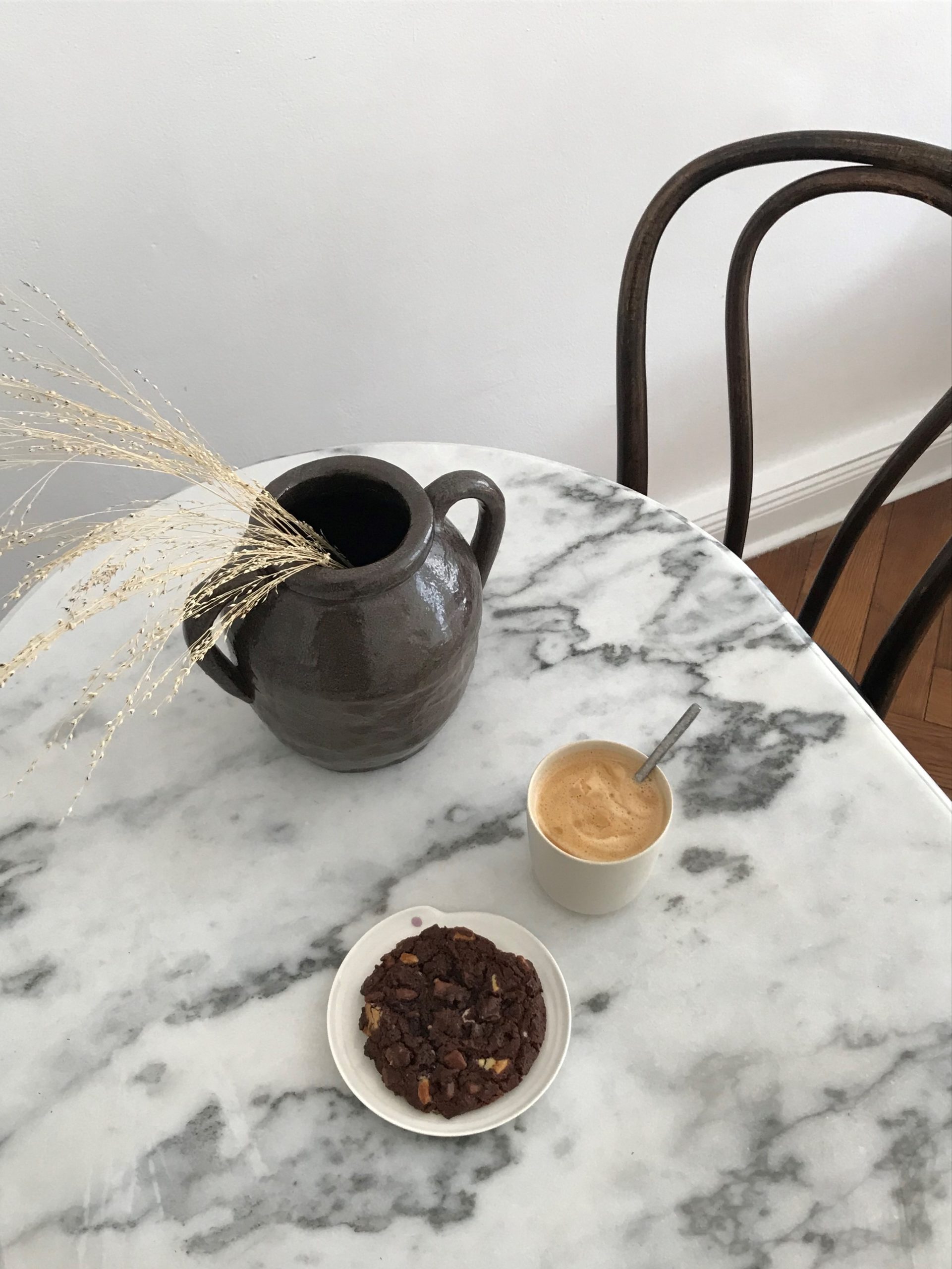 coffee and chocolate cookie, marble table thonet chair, minimal home, scandinavian interior, ceramic, home office, Bedroom Decor Details, Dried Flowers, beige storage, mirror, Hay Matin Lamp, minimal style neutral home, slow living | RG Daily Blog