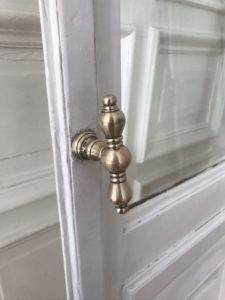 vintage gold door handles, european interior design inspo, historic building, white french doors | RG Daily Blog