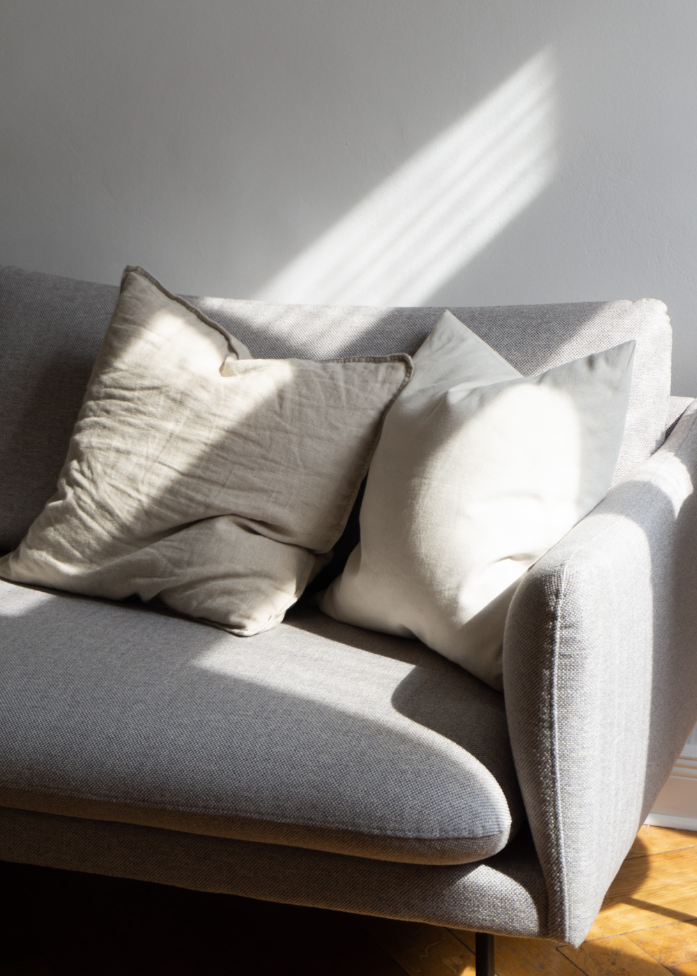 Grey Sofa, Beige Pillows, Light and Shadows - Neutral Home, Scandinavian Aesthetic, Berlin Apartment, White Interior, Calm Lighting | RG Daily Blog