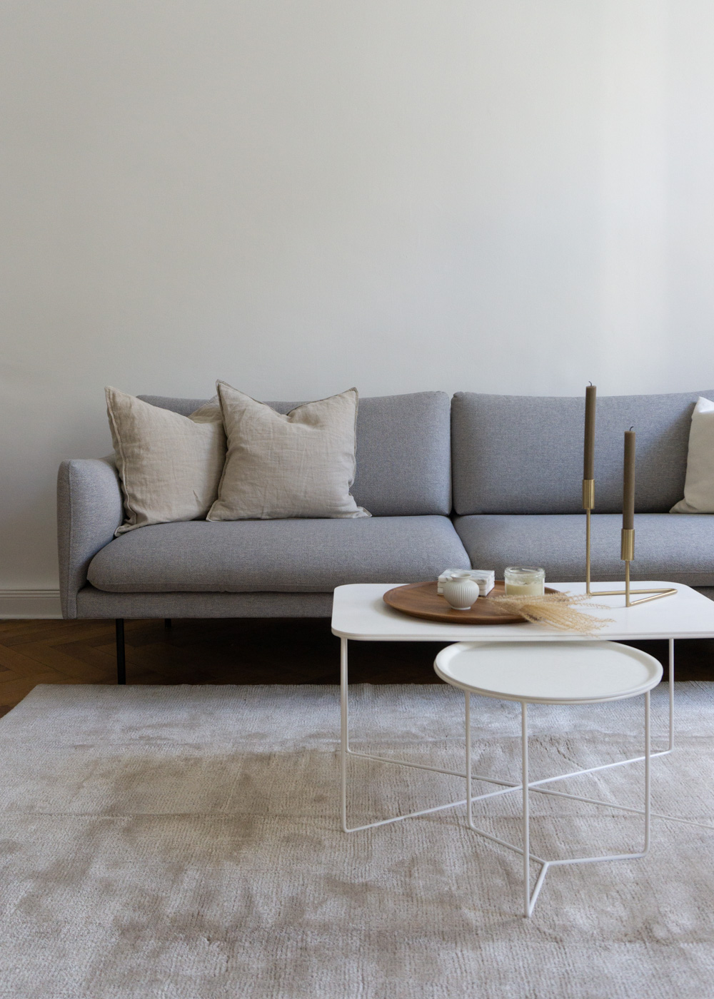 Neutral Living Room, Grey Sofa, White Tables, Beige Rug, Tan Pillows - Neutral Home, Scandinavian Aesthetic, Berlin Apartment, White Interior, Calm Lighting | RG Daily Blog