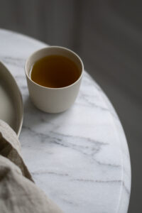 Kleo Co Ceramic Porcelain Tea Minimalist Design Scandinavian Home Product Photography Marble Table Setting Light Shadows Neutral Aesthetic Slow Living